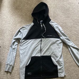 Black and grey rocawear zip up. Great condition. Used one time. Size M